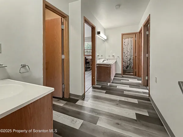 a view of front door with hallway and a window