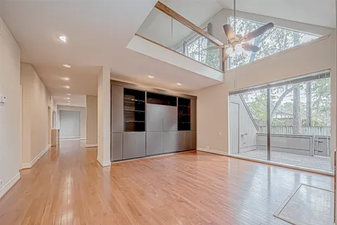 a large kitchen with stainless steel appliances kitchen island granite countertop a large counter top and a stove top oven