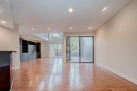 a view of an empty room with a ceiling fan