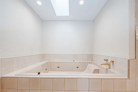 a bathroom with a bathtub and a sink