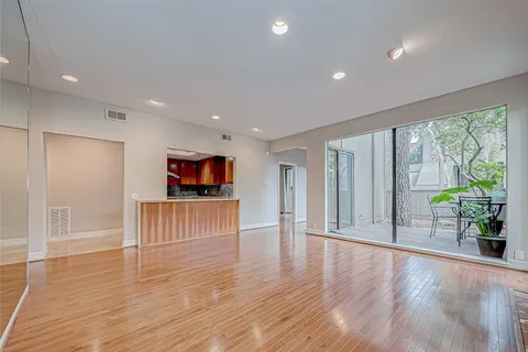 a view of outdoor space with wooden floor and windows