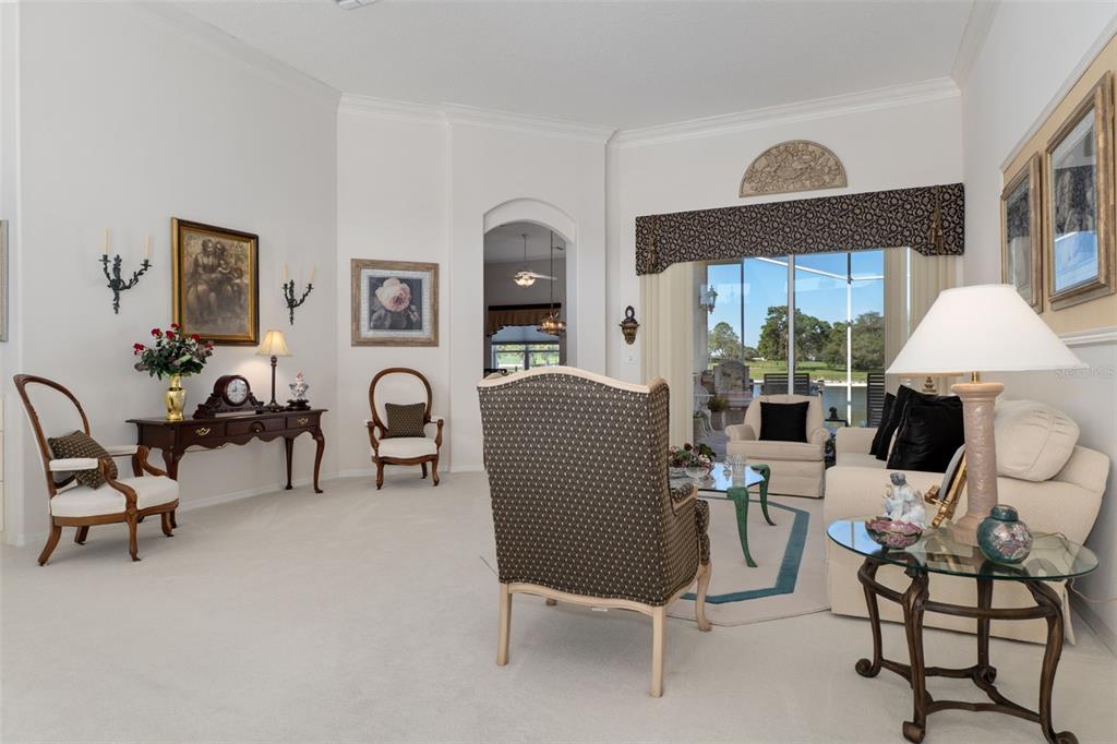 10081 Georgetown Court Weeki Wachee, FL 34613 - Photo 6 of 76 a living room with furniture and a large window