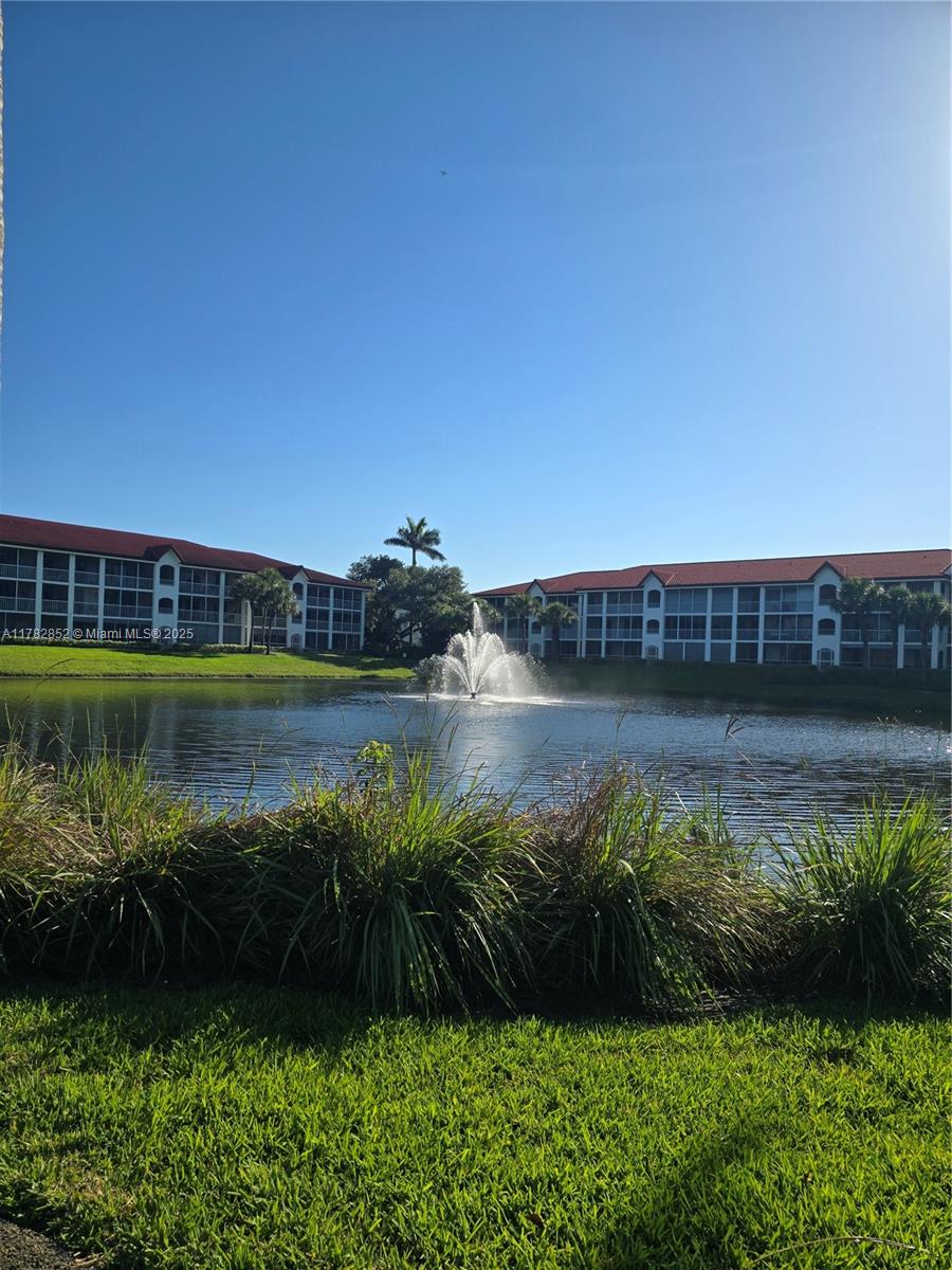 7020 Half Moon Circle, Unit 511 Hypoluxo, FL 33462 - Photo 15 of 28 a view of a lake view