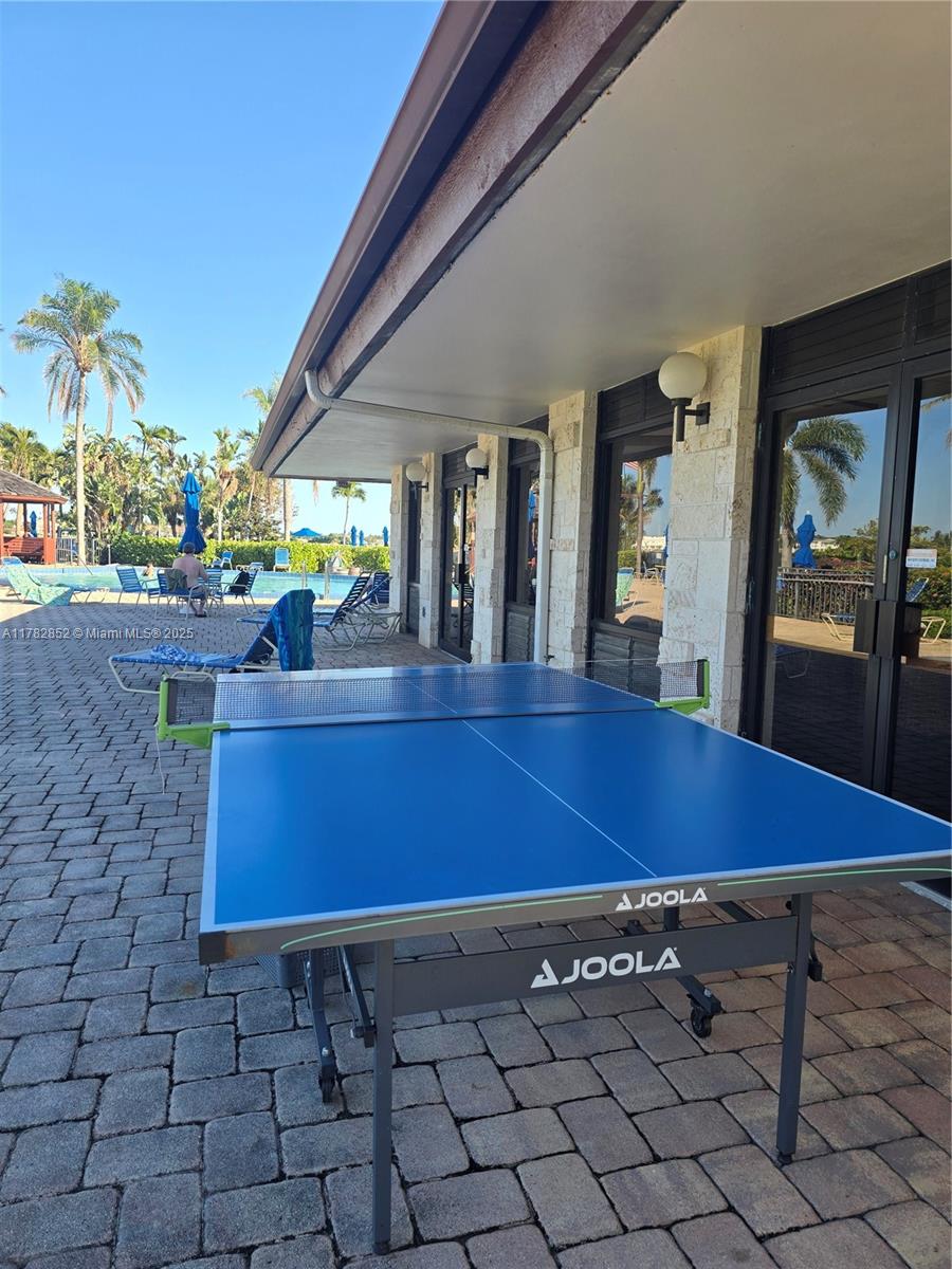 7020 Half Moon Circle, Unit 511 Hypoluxo, FL 33462 - Photo 16 of 28 a room with pool table and windows