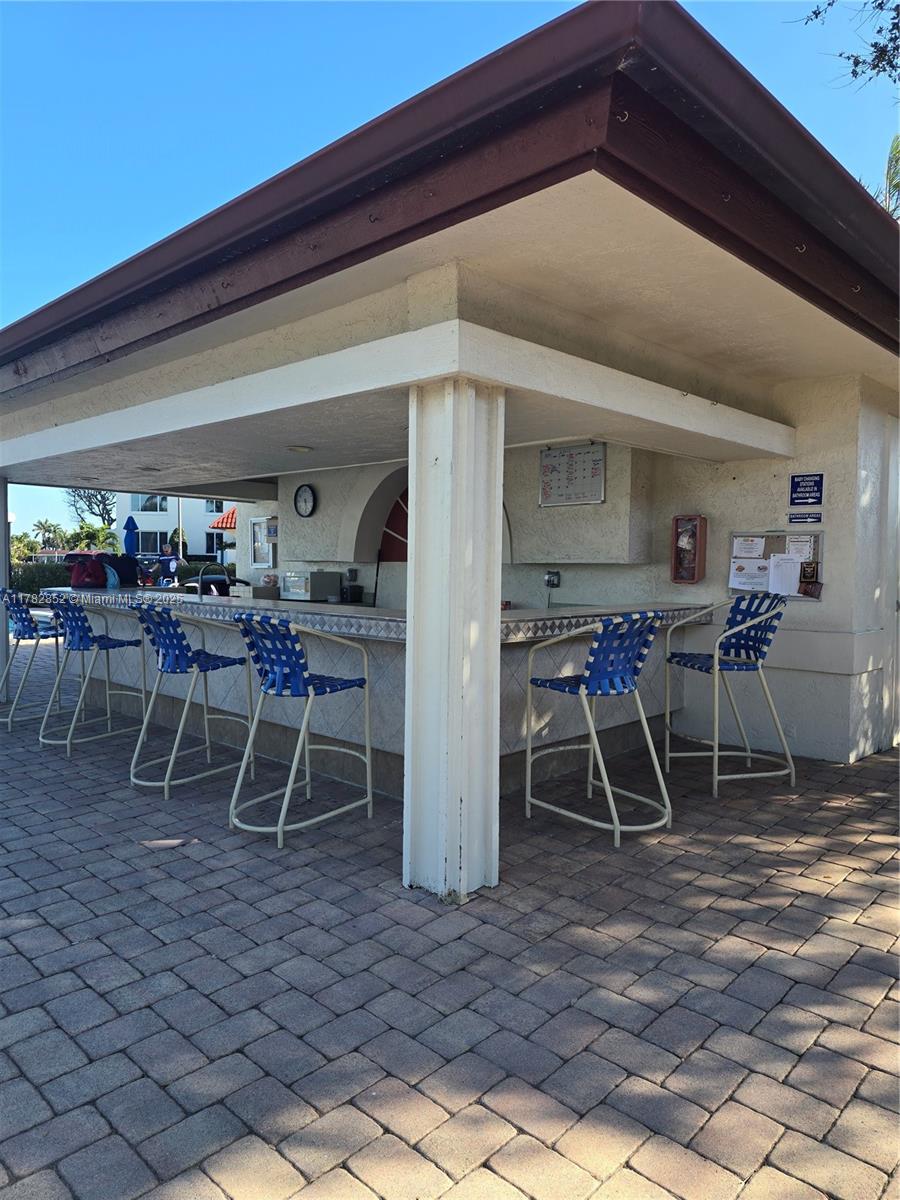 7020 Half Moon Circle, Unit 511 Hypoluxo, FL 33462 - Photo 18 of 28 a dining room with furniture
