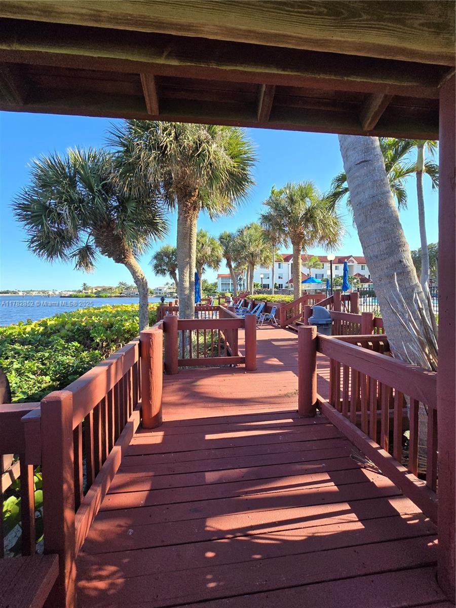 7020 Half Moon Circle, Unit 511 Hypoluxo, FL 33462 - Photo 22 of 28 a view of outdoor space with deck having patio
