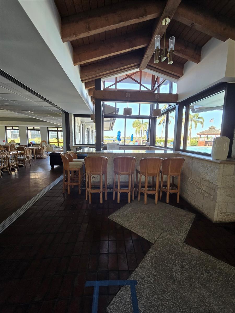 7020 Half Moon Circle, Unit 511 Hypoluxo, FL 33462 - Photo 26 of 28 a dining room with lots of tables and chairs