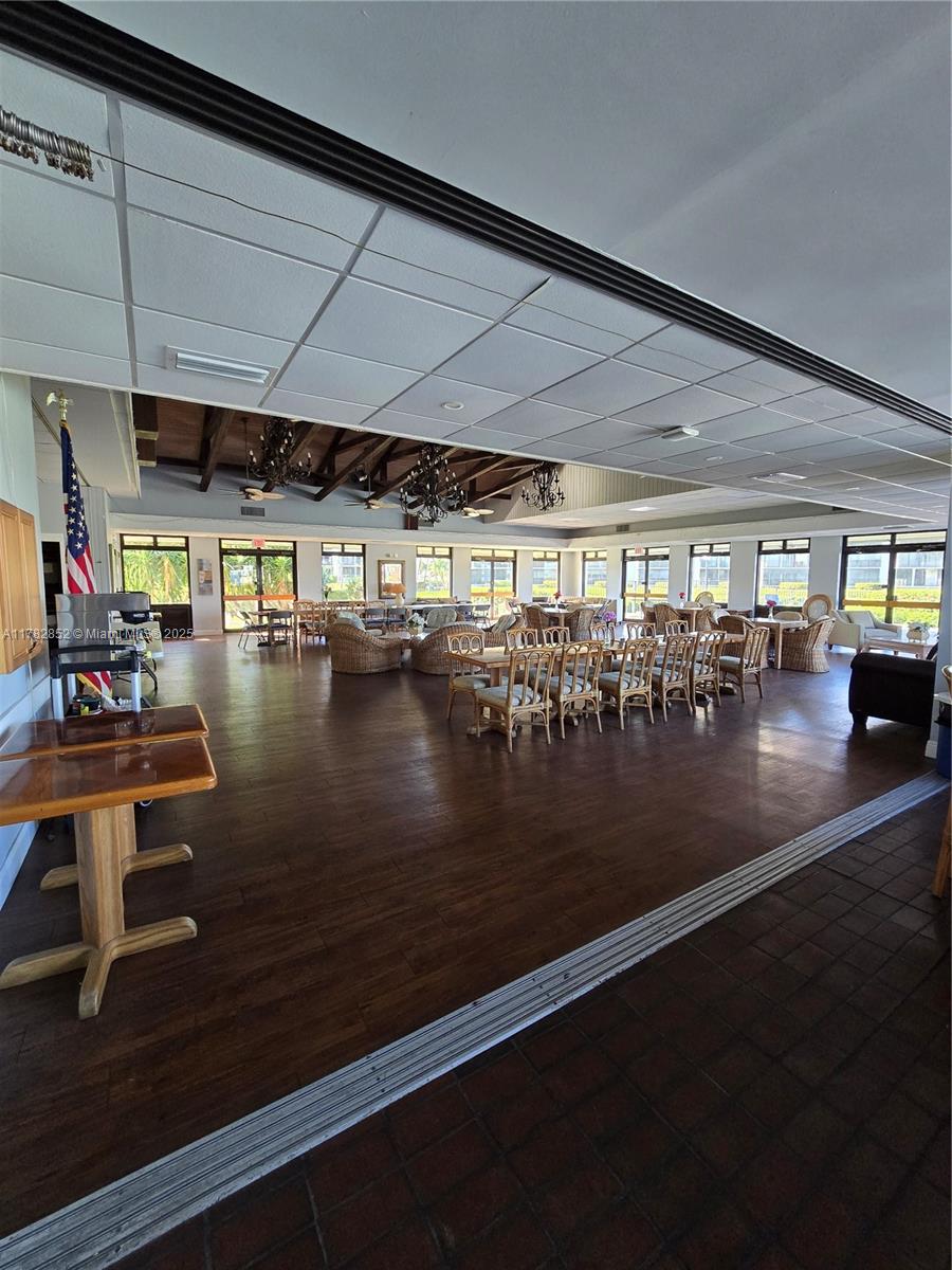 7020 Half Moon Circle, Unit 511 Hypoluxo, FL 33462 - Photo 27 of 28 a view of a room with lots of wooden furniture