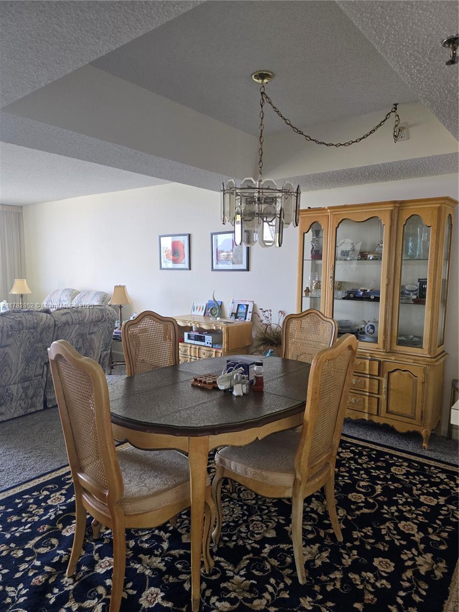 7020 Half Moon Circle, Unit 511 Hypoluxo, FL 33462 - Photo 5 of 28 a view of a dining room with furniture