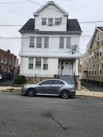a car parked in front of a house