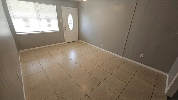 a view of wooden floor and windows in a room