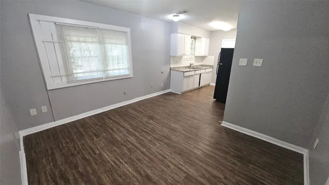 a kitchen that has a sink and a window