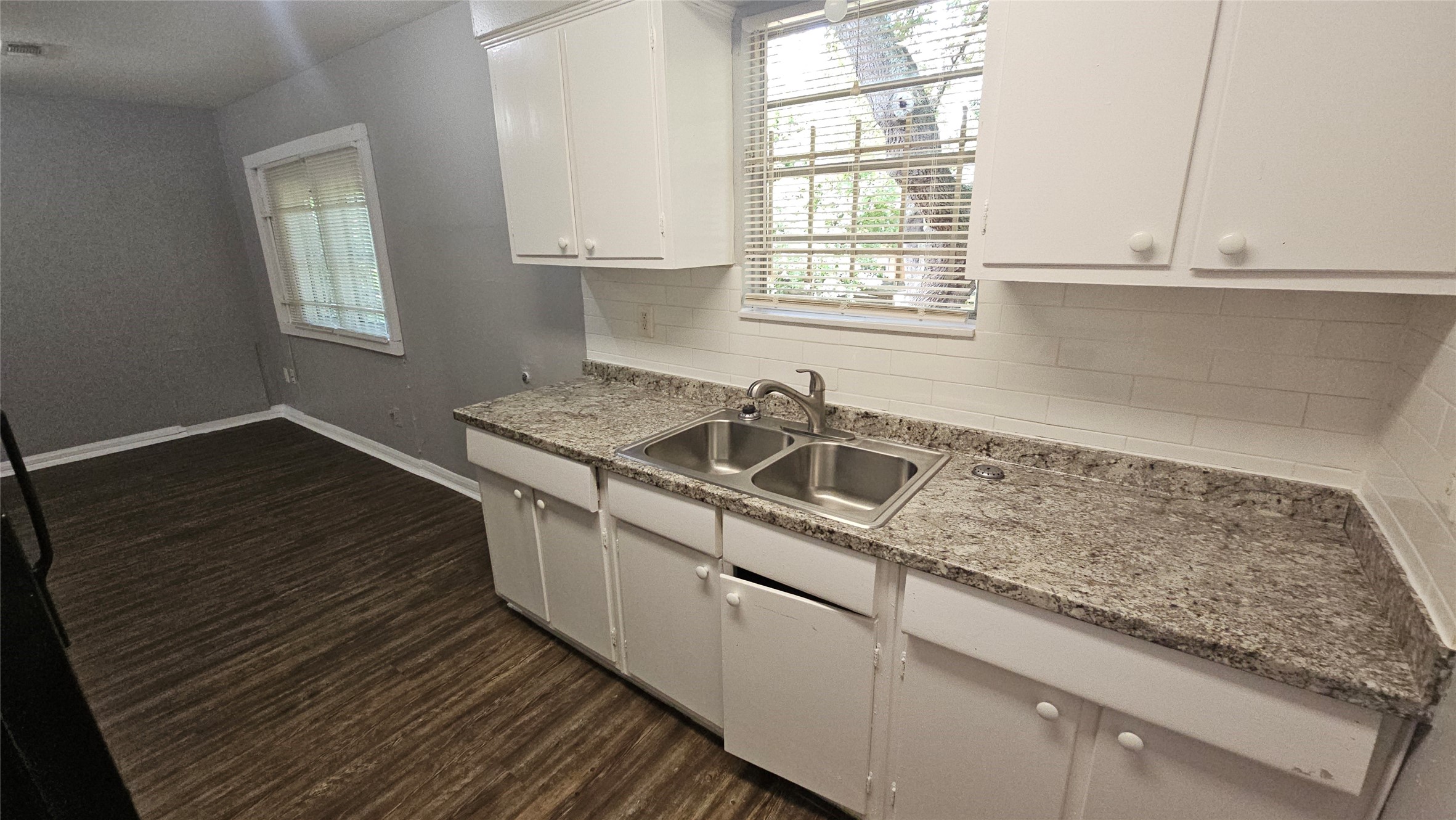 10806 Safeguard Street Houston, TX 77047 - Photo 5 of 10 a kitchen that has a sink and a window
