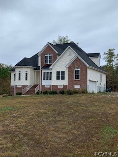 7360 Trevor’s Road Charles City, VA 23030 - Photo 1 of 1 a view of a yard in front of a house with a large tree