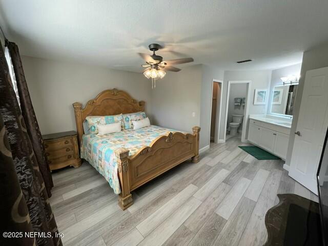 17 Arbor Club Drive, Unit 212 Ponte Vedra Beach, FL 32082 - Photo 14 of 29 a bed sitting in a bedroom next to a window