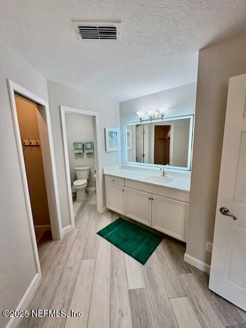 17 Arbor Club Drive, Unit 212 Ponte Vedra Beach, FL 32082 - Photo 16 of 29 a kitchen with a sink and a wooden floor