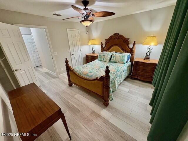 17 Arbor Club Drive, Unit 212 Ponte Vedra Beach, FL 32082 - Photo 20 of 29 a bedroom with a bed and wooden floor