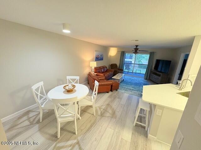 17 Arbor Club Drive, Unit 212 Ponte Vedra Beach, FL 32082 - Photo 8 of 29 a living room with furniture and wooden floor