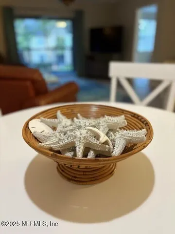 a kitchen with a sink and a wooden floor