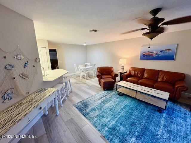 17 Arbor Club Drive, Unit 212 Ponte Vedra Beach, FL 32082 - Photo 10 of 29 a living room with furniture and a wooden floor
