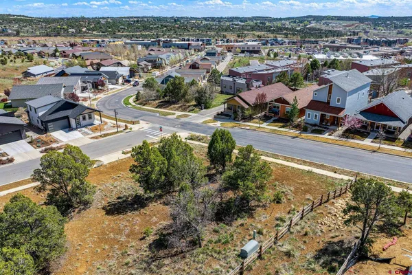 an aerial view of residential houses with outdoor space