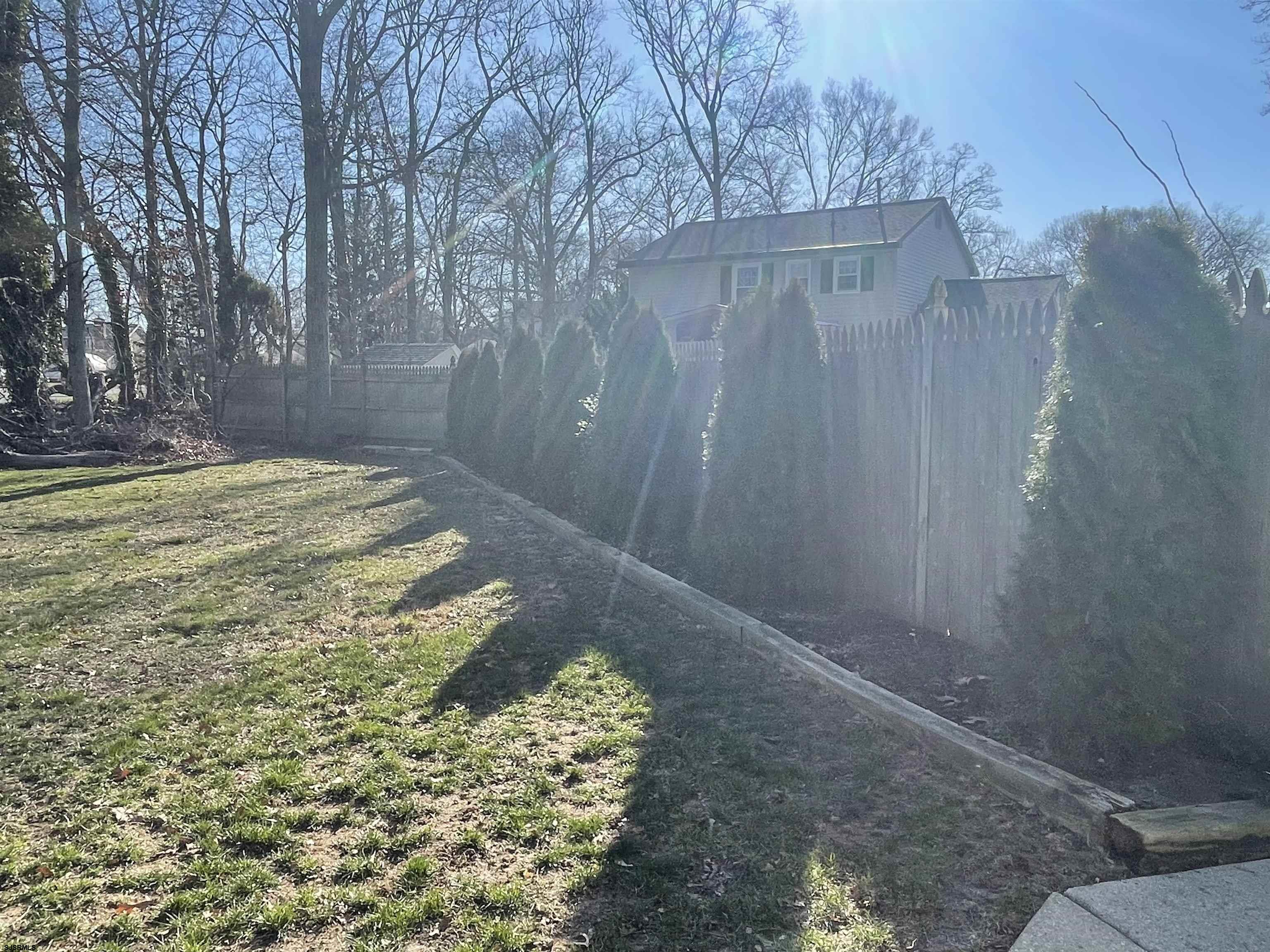 401 Mill Road Absecon, NJ 08201 - Photo 6 of 35 Want more area, extend the fence into the huge side yard