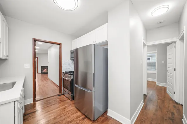 a view of hallway with wooden floor