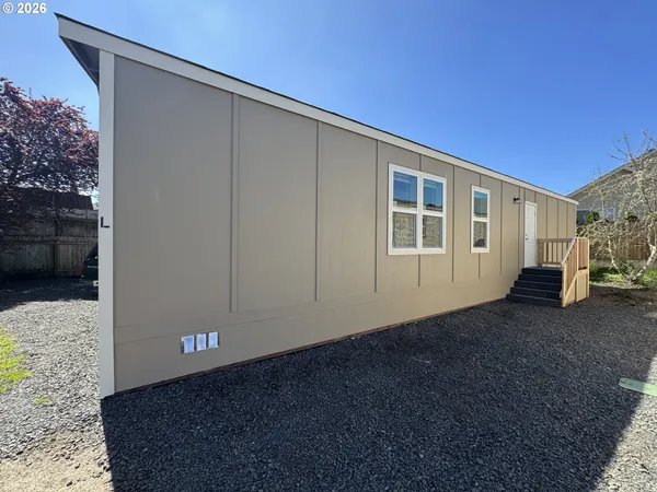 a view of a house with a backyard
