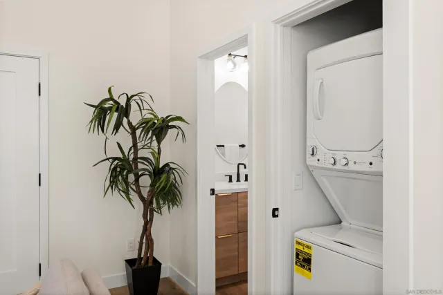 a view of hallway with paintings on the wall