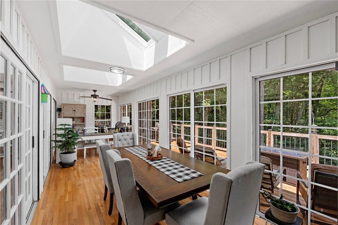 300 Whispering Falls Road Pickens, SC 29671 - Photo 12 of 41 Natural light pours through dual skylights in this inviting space featuring rich hardwood floors.
