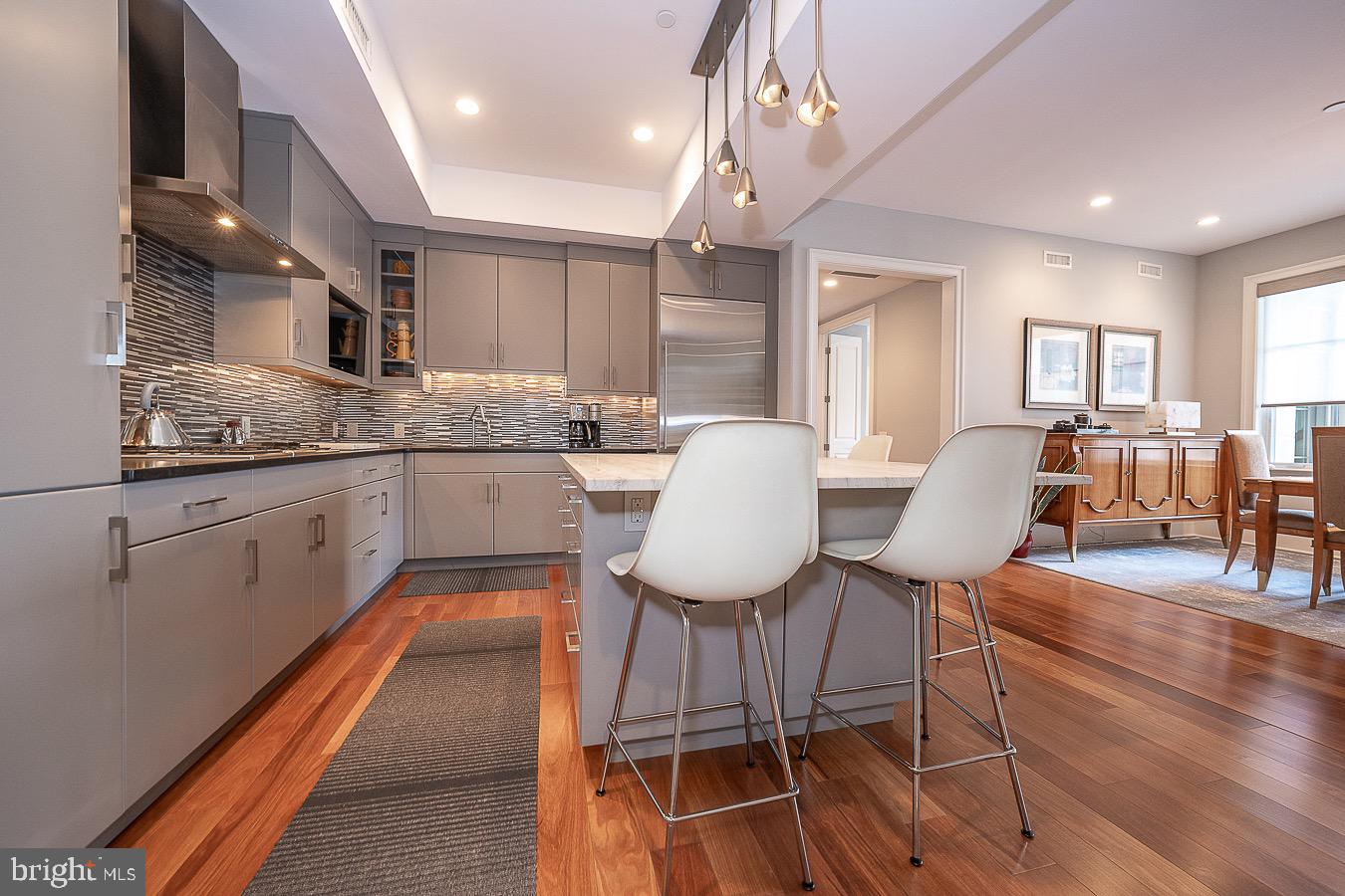 100 St Georges Road, Unit A3 Ardmore, PA 19003 - Photo 17 of 43 a kitchen with granite countertop counter space dining table and stainless steel appliances