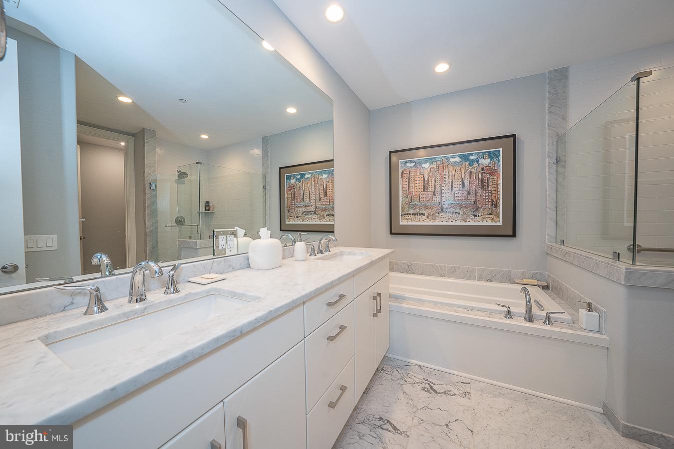 100 St Georges Road, Unit A3 Ardmore, PA 19003 - Photo 22 of 43 a bathroom with a double vanity sink mirror and bathtub