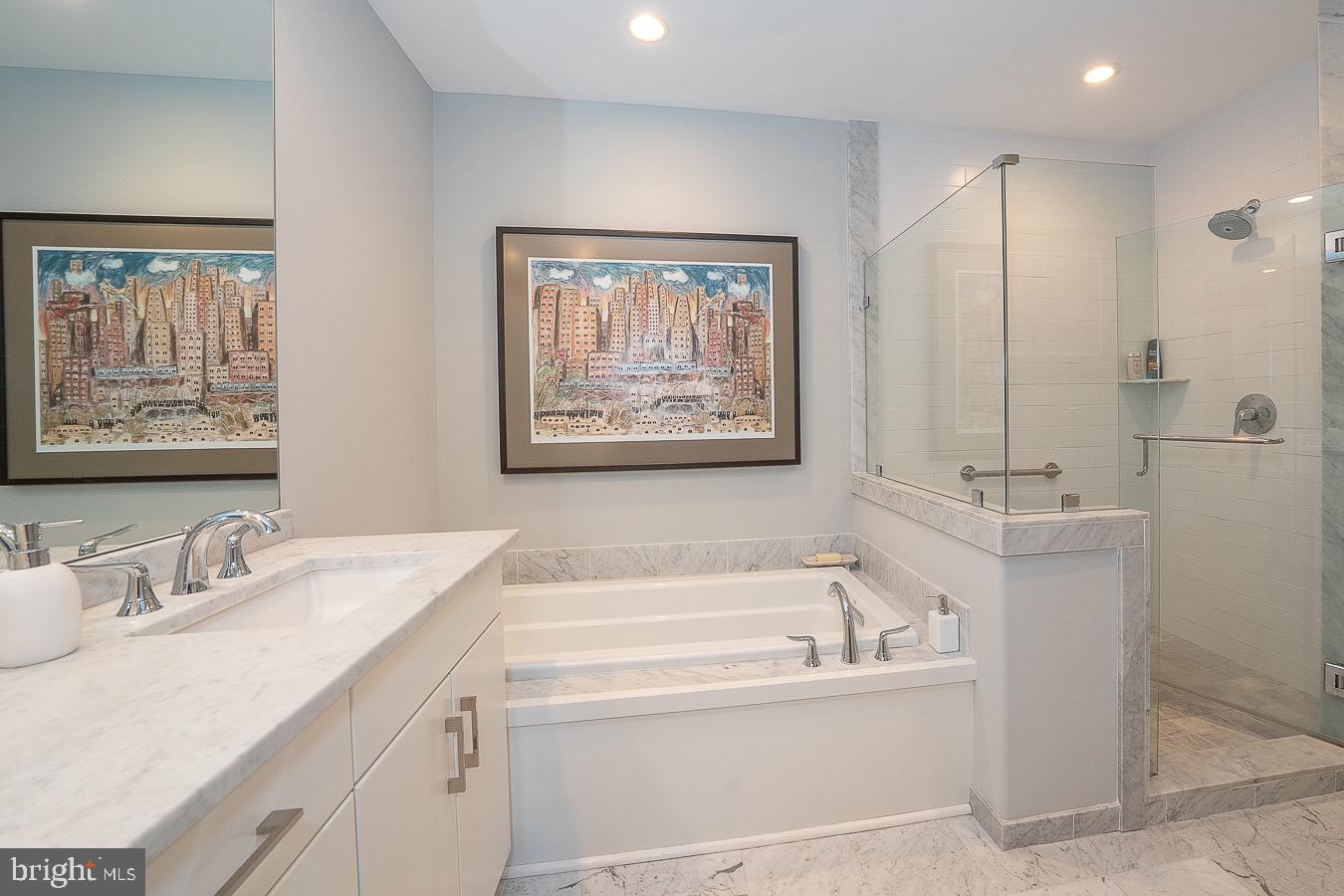 100 St Georges Road, Unit A3 Ardmore, PA 19003 - Photo 24 of 43 a bathroom with a tub a sink and mirror