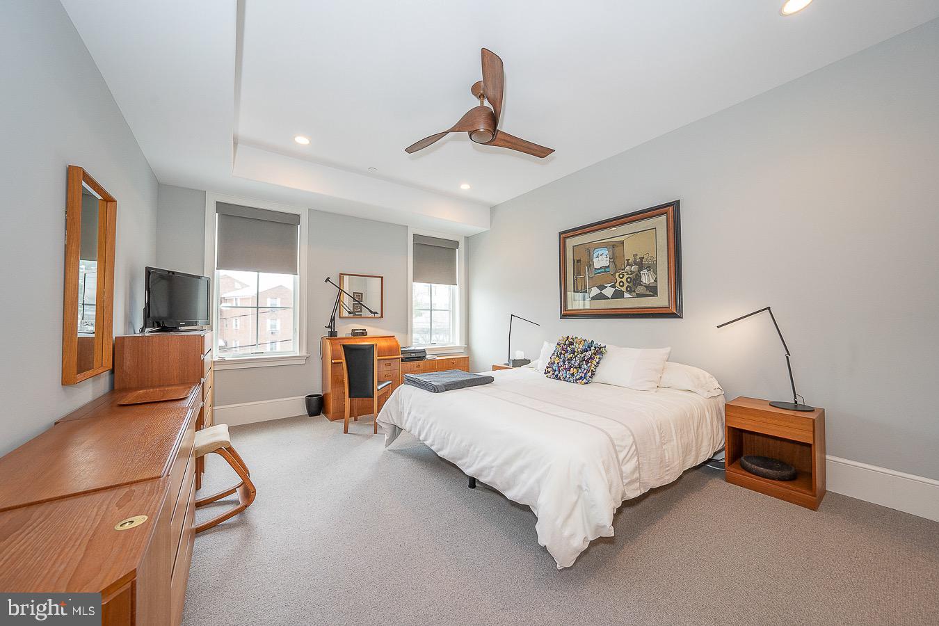 100 St Georges Road, Unit A3 Ardmore, PA 19003 - Photo 33 of 43 a bedroom with a bed and a chandelier