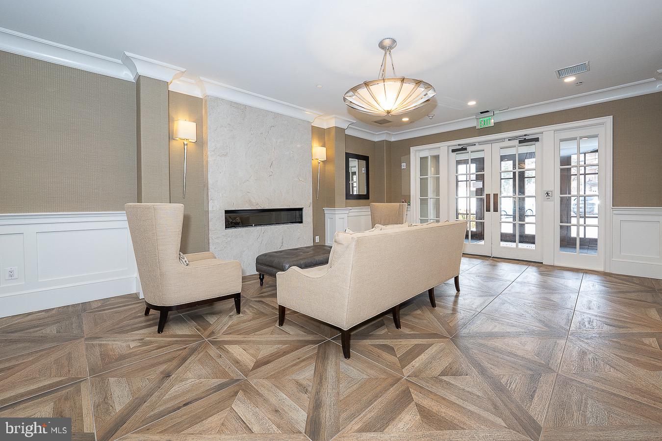 100 St Georges Road, Unit A3 Ardmore, PA 19003 - Photo 40 of 43 a living room with furniture and a chandelier