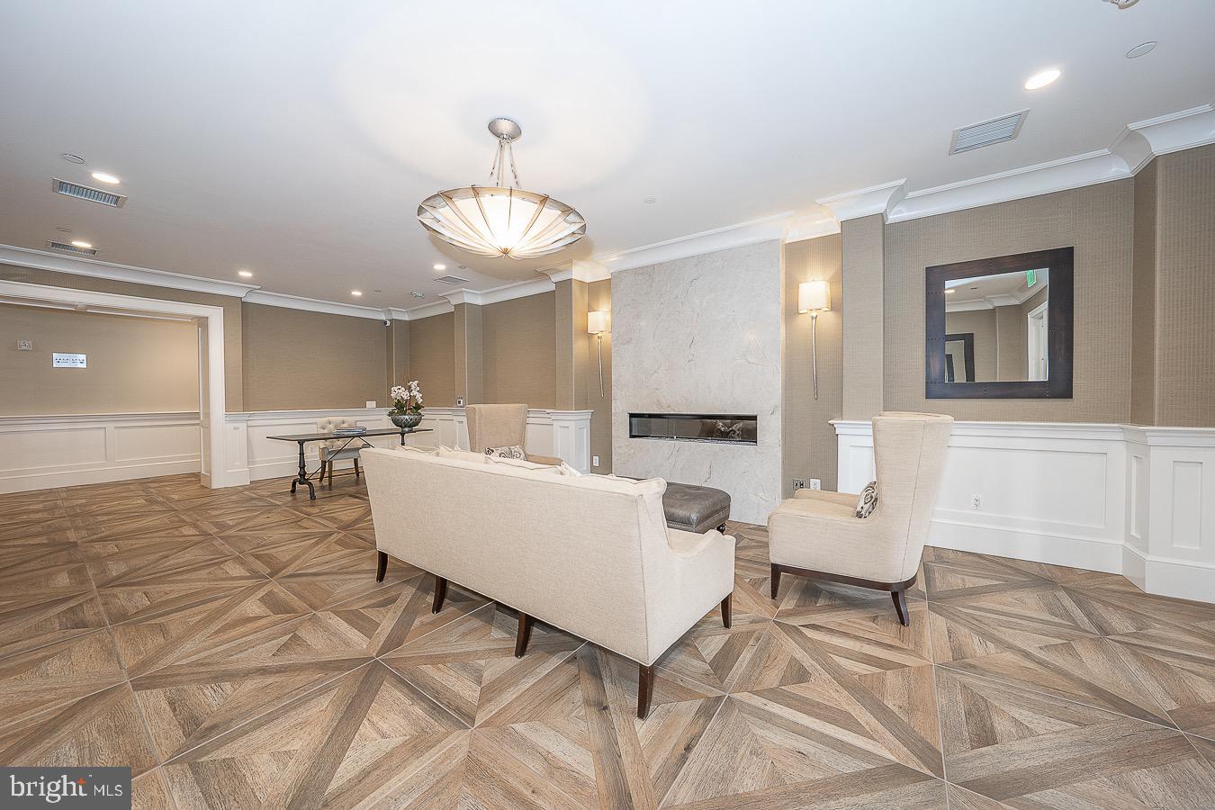 100 St Georges Road, Unit A3 Ardmore, PA 19003 - Photo 41 of 43 a living room with couches and kitchen view with wooden floor