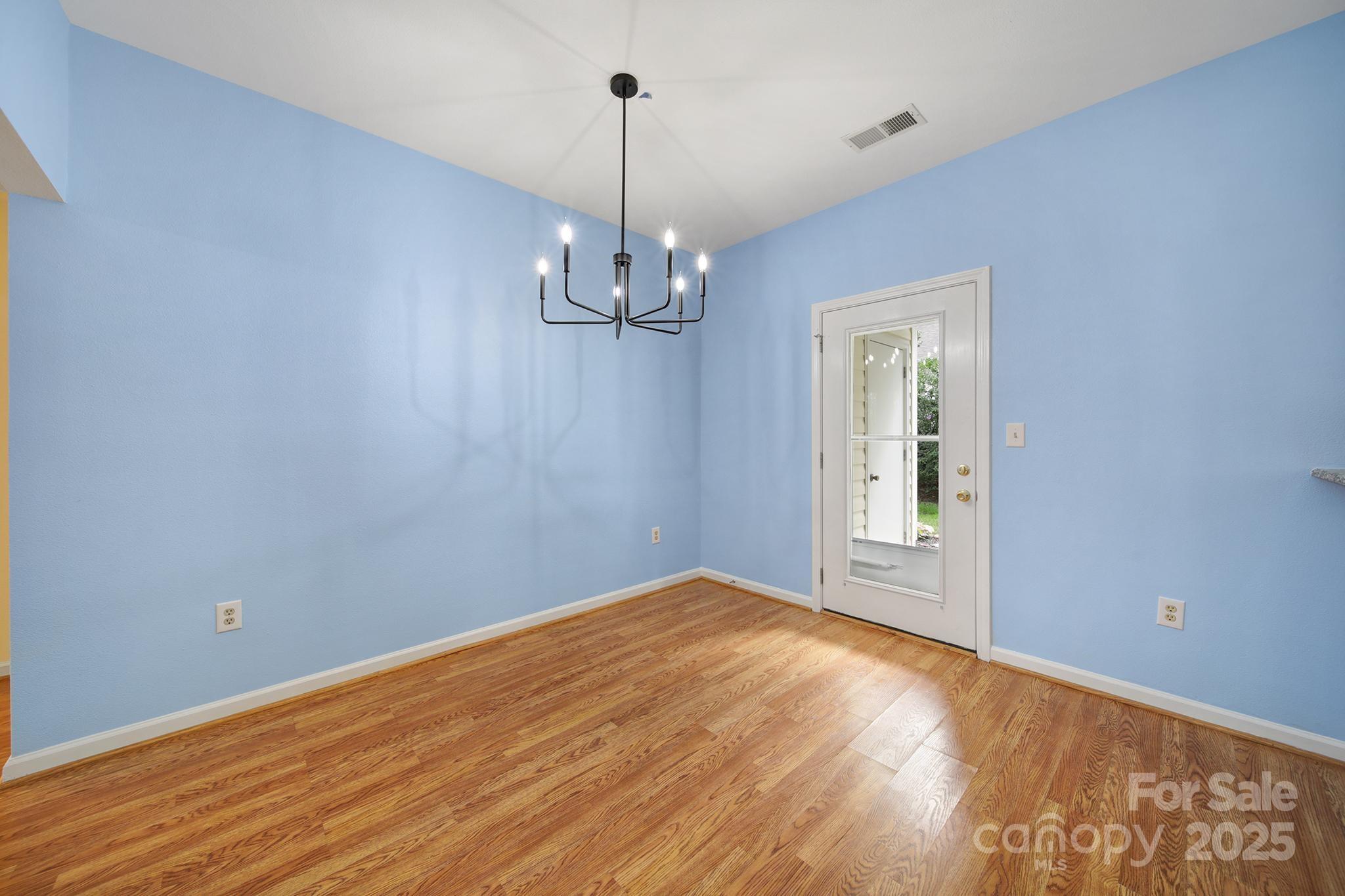 614 Stone Village Drive Fort Mill, SC 29708 - Photo 12 of 42 a view of empty room with wooden floor