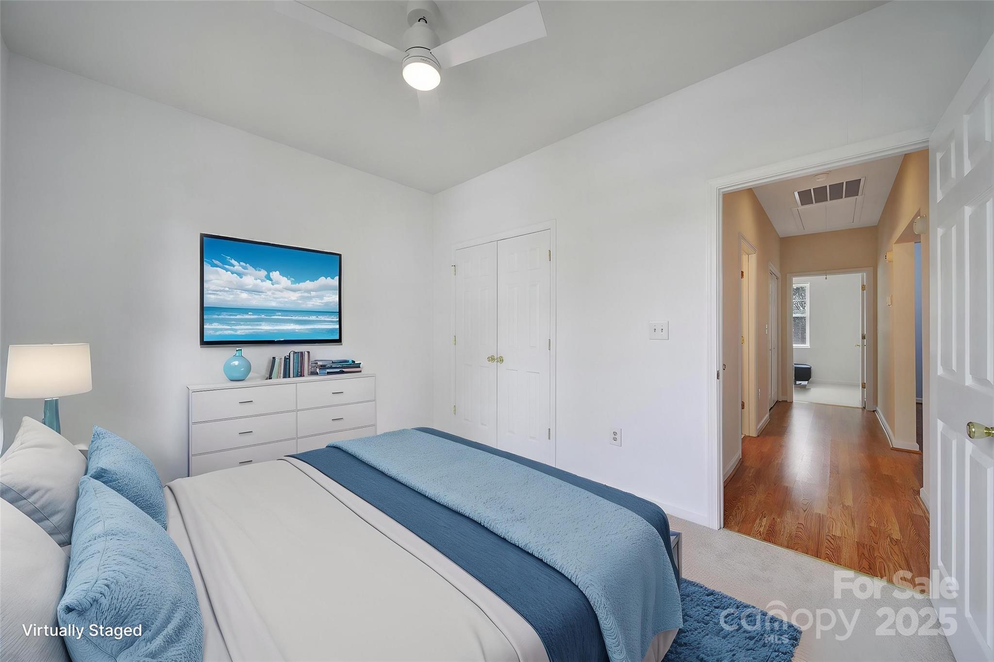 614 Stone Village Drive Fort Mill, SC 29708 - Photo 21 of 42 a bedroom with a bed and a lamp on table