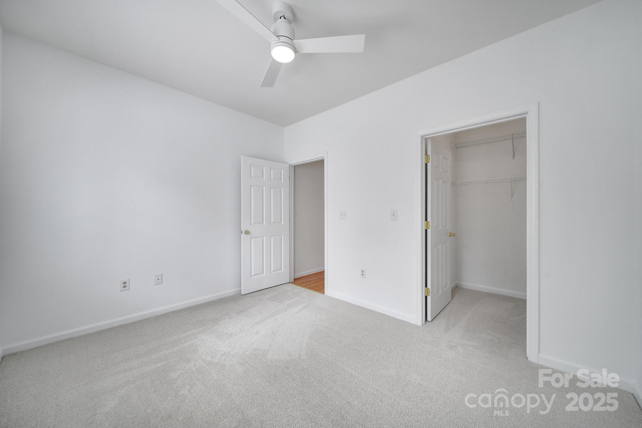 614 Stone Village Drive Fort Mill, SC 29708 - Photo 26 of 42 an empty room with a ceiling fan and a window
