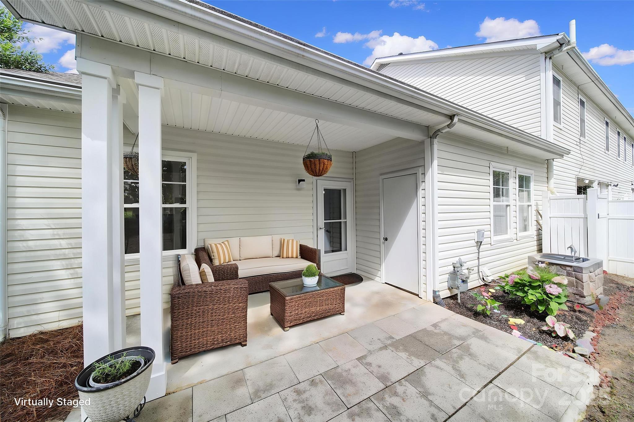614 Stone Village Drive Fort Mill, SC 29708 - Photo 29 of 42 a view of a patio with couches and potted plants