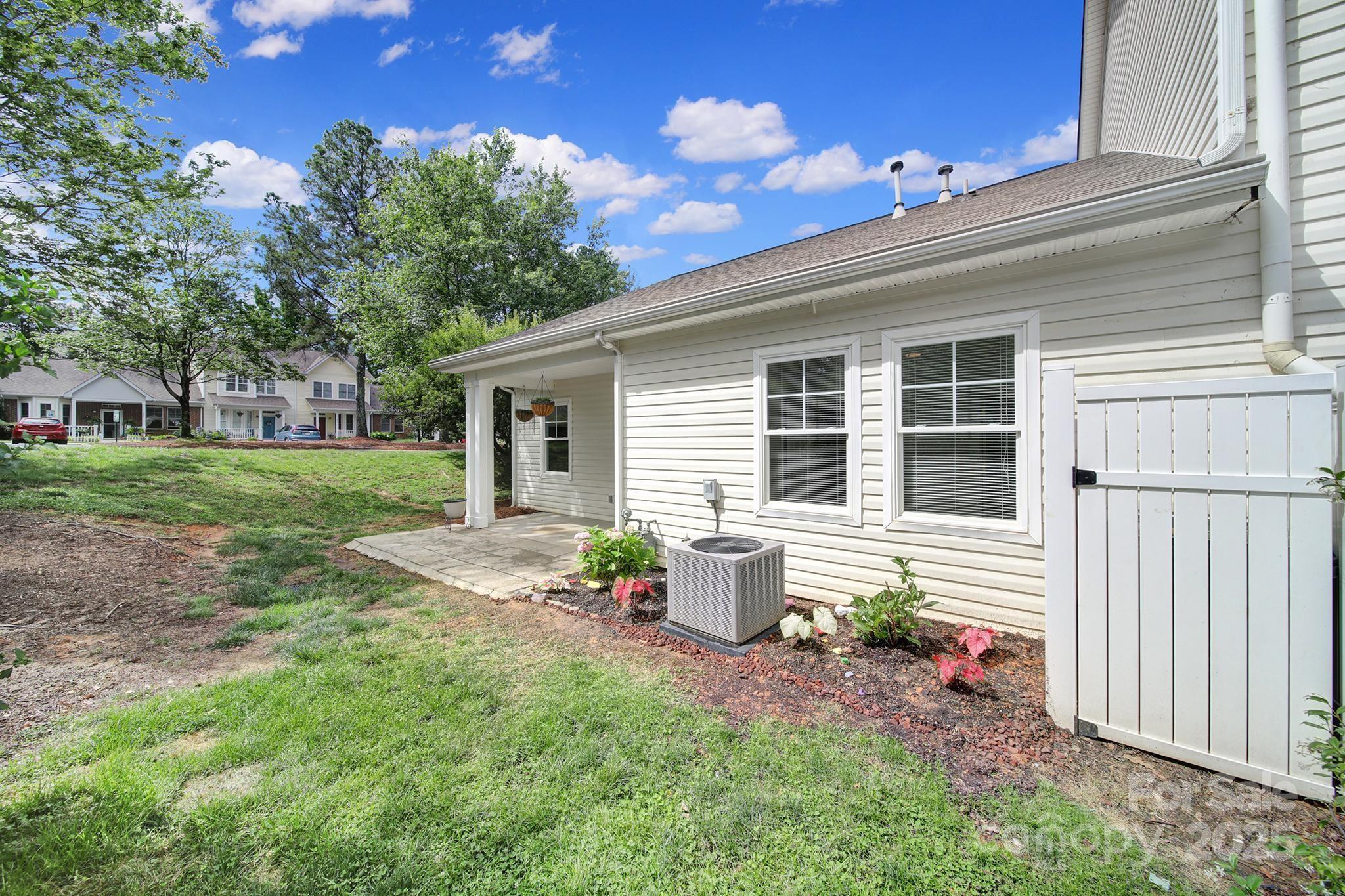 614 Stone Village Drive Fort Mill, SC 29708 - Photo 32 of 42 a front view of a house with garden