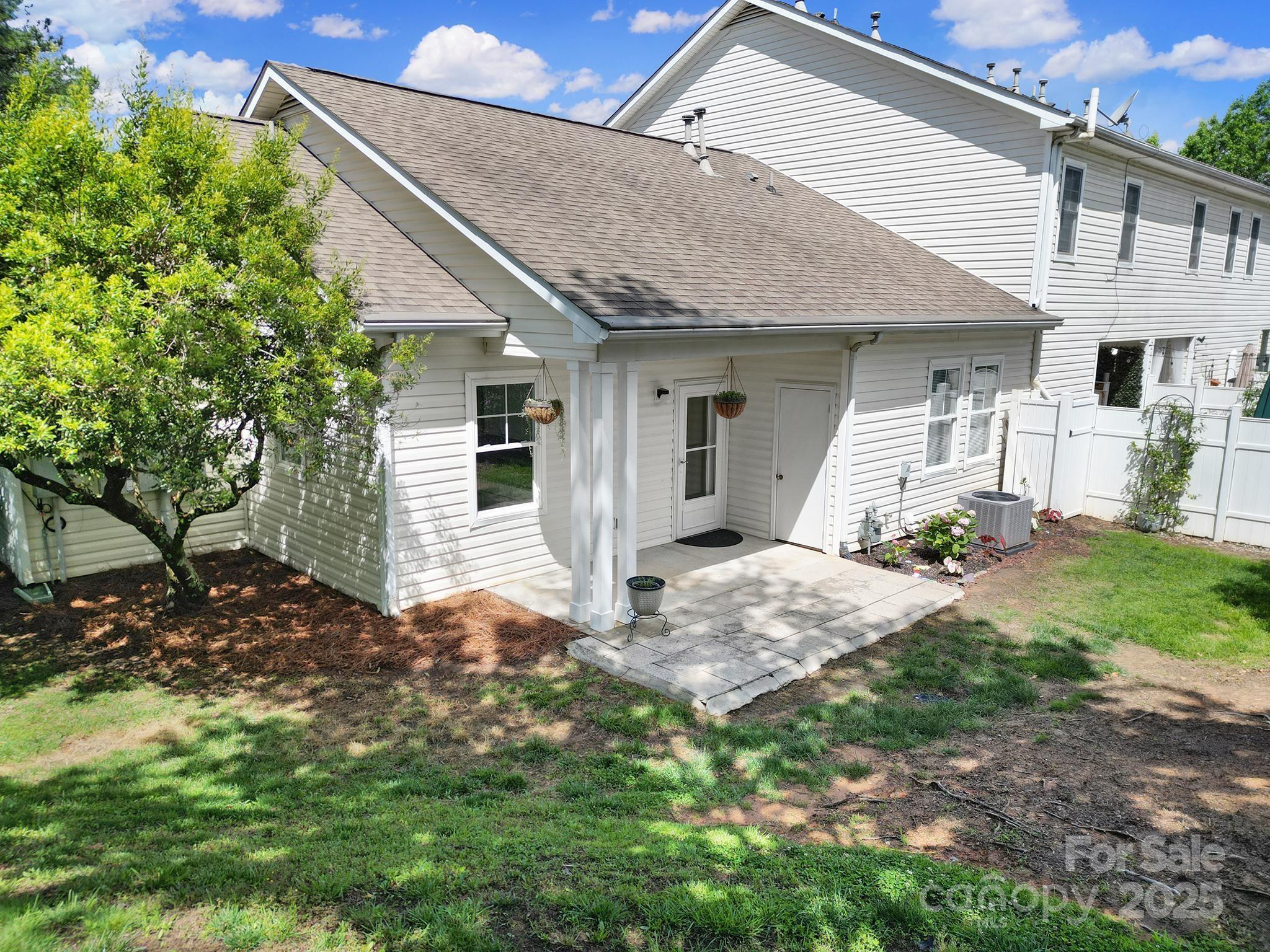 614 Stone Village Drive Fort Mill, SC 29708 - Photo 33 of 42 a front view of a house with garden