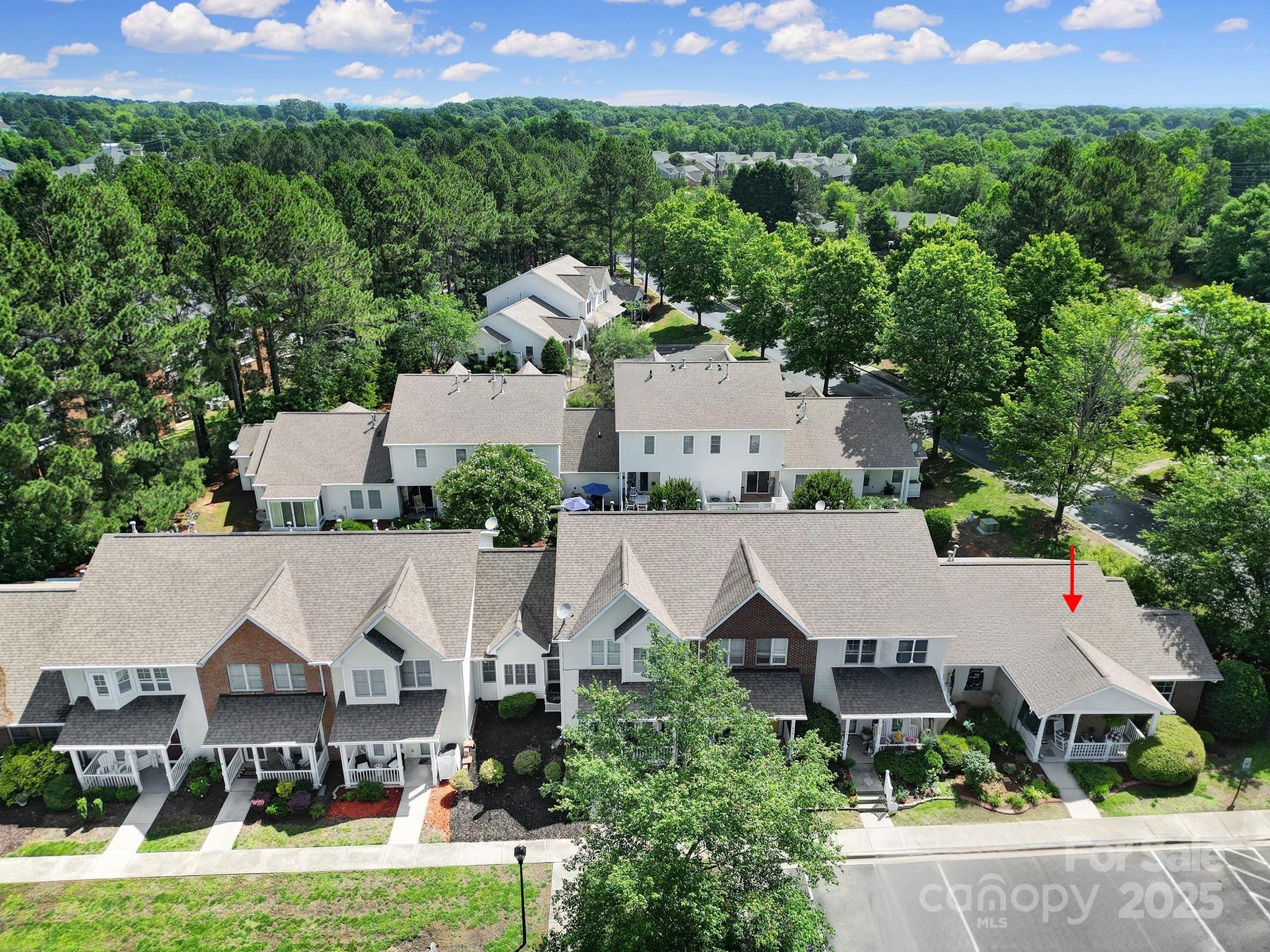 614 Stone Village Drive Fort Mill, SC 29708 - Photo 37 of 42 an aerial view of residential houses with outdoor space and trees