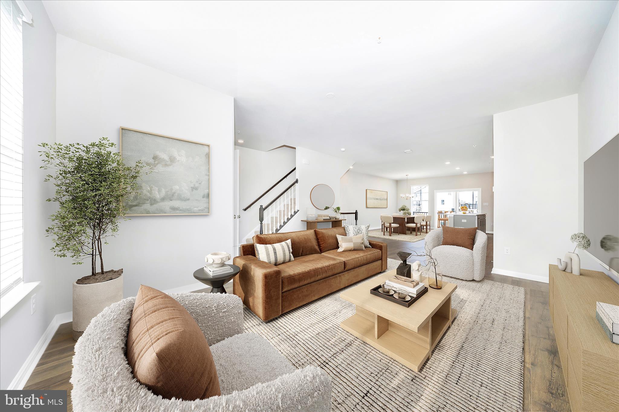 726 Compass Way Frederick, MD 21701 - Photo 13 of 55 a living room with furniture and a potted plant