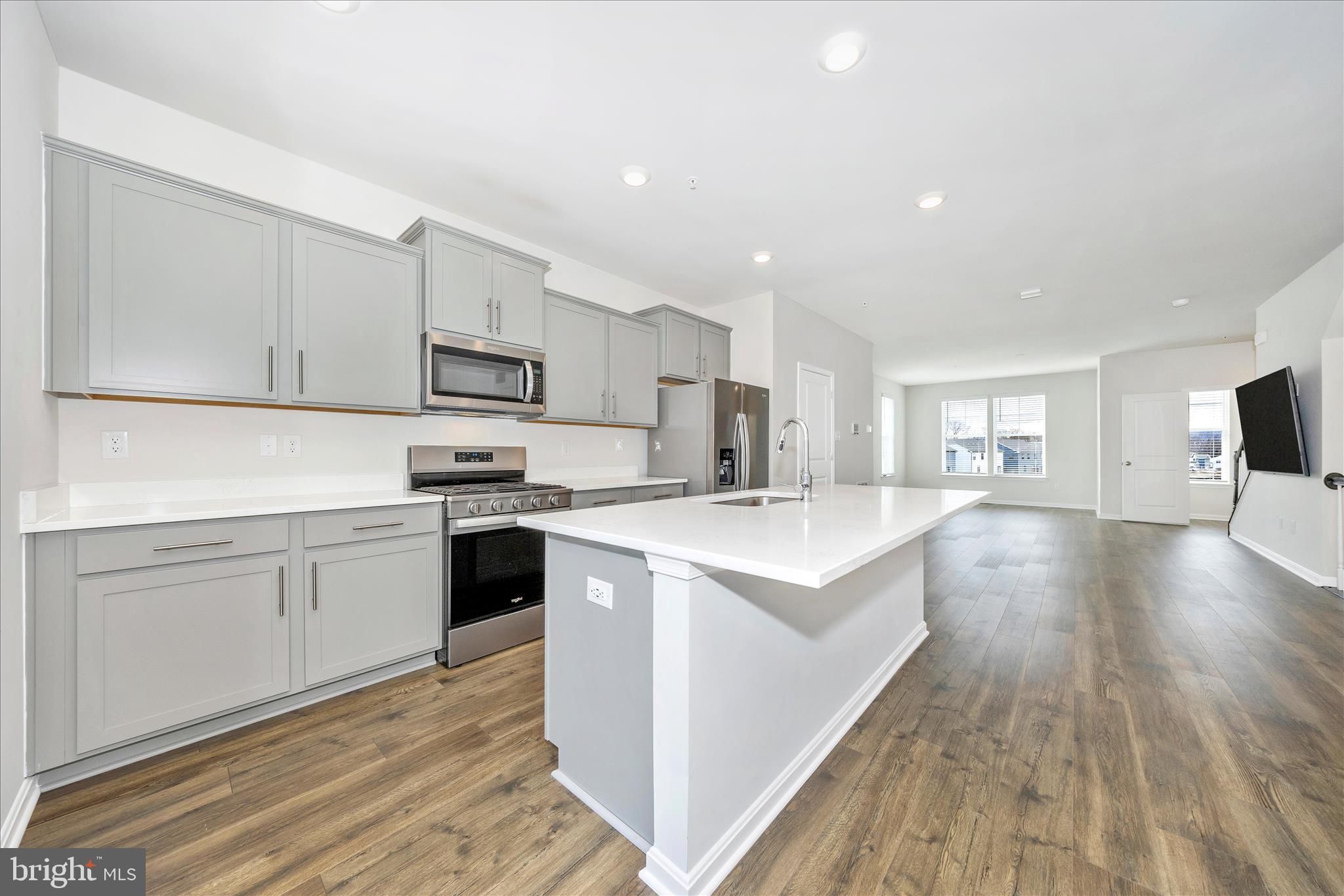 726 Compass Way Frederick, MD 21701 - Photo 18 of 55 a kitchen with white cabinets appliances and sink