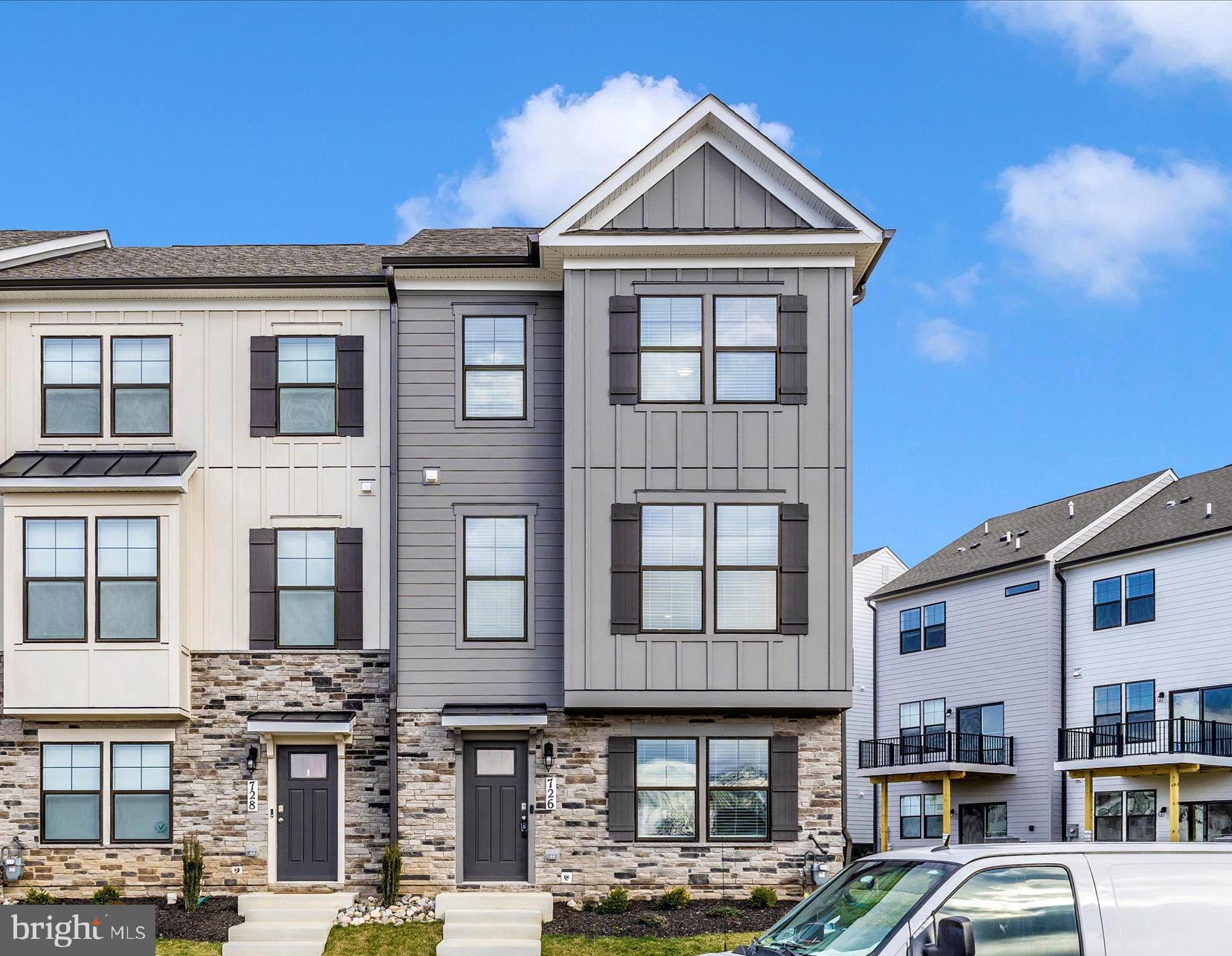 726 Compass Way Frederick, MD 21701 - Photo 2 of 55 a front view of a building with parking space