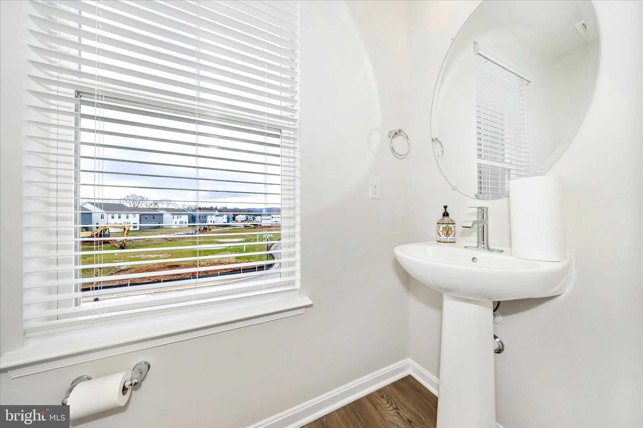 726 Compass Way Frederick, MD 21701 - Photo 27 of 55 a bathroom with a sink and a window