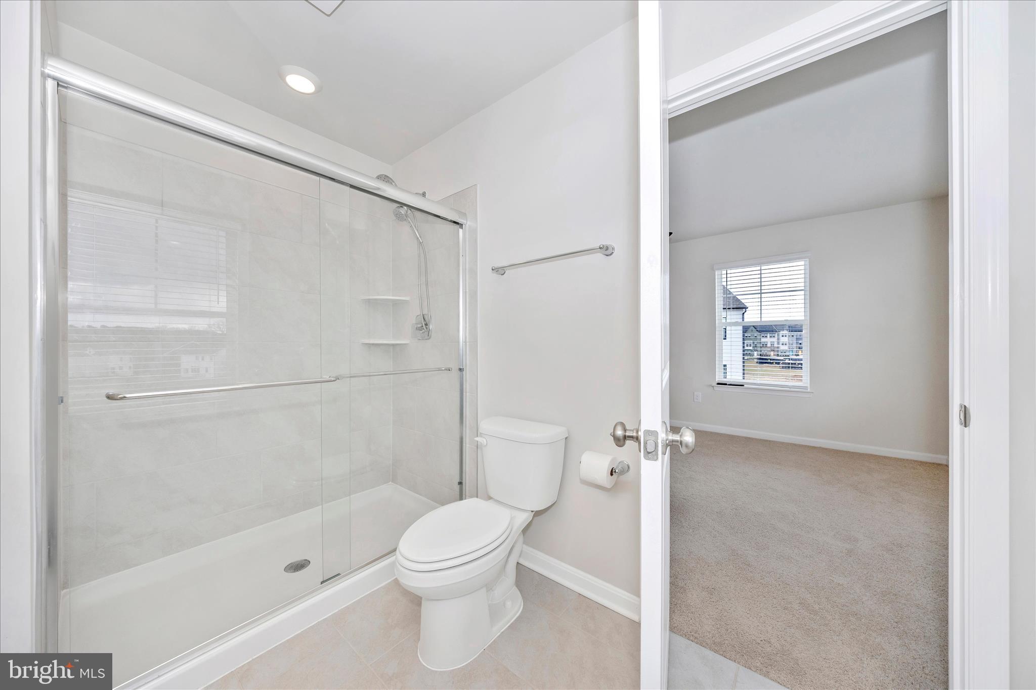 726 Compass Way Frederick, MD 21701 - Photo 39 of 55 a bathroom with a toilet and a shower