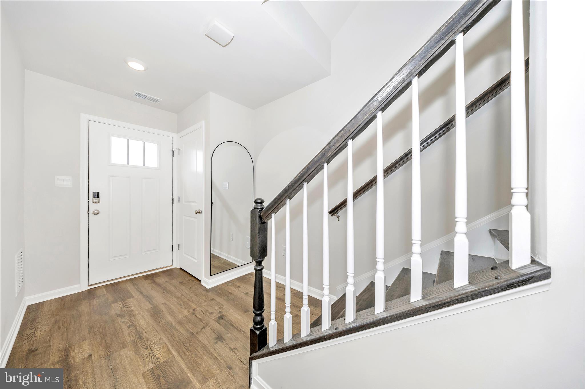 726 Compass Way Frederick, MD 21701 - Photo 4 of 55 a view of staircase with wooden floor and stairs