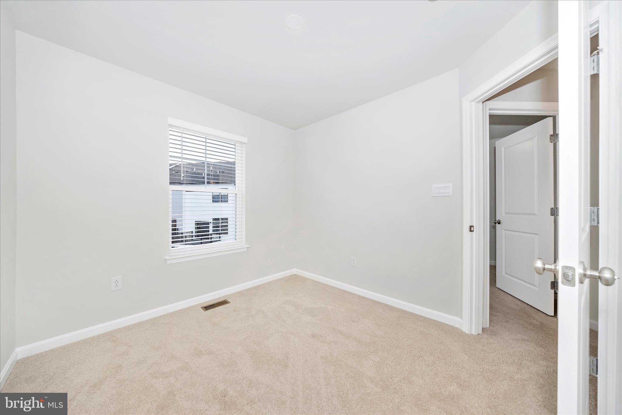 726 Compass Way Frederick, MD 21701 - Photo 41 of 55 an empty room with a window